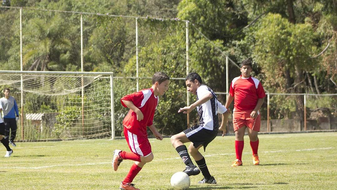 Photo of boys playing soccer.